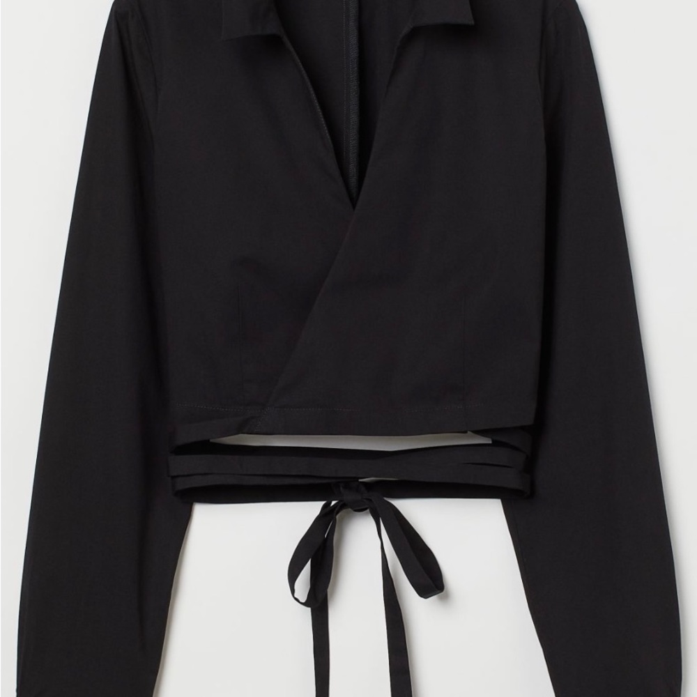 Black wrap crop top with waist detail.